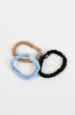 Glow Beauty silk hair ties worn on wrist