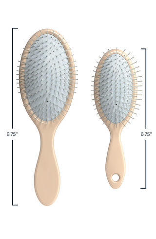 Glow Beauty Mini Detangling Brush in hand for scale