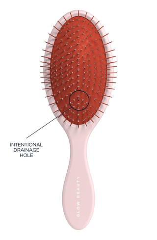 Glow Beauty Detangling Brush in ballerina pink — drainage hole detail