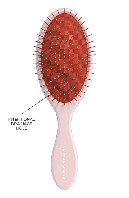 Glow Beauty Detangling Brush in ballerina pink — drainage hole detail