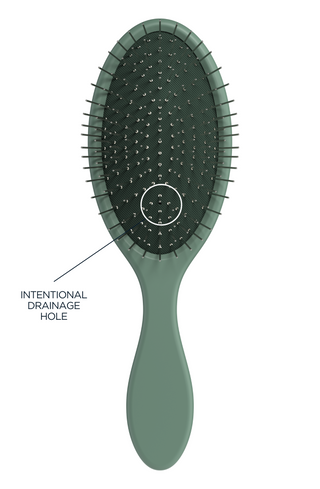 Glow Beauty Detangling Brush in olive green — drainage hole detail