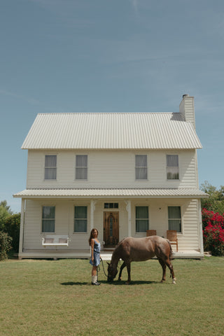 Denim dress with a horse at a farmhouse